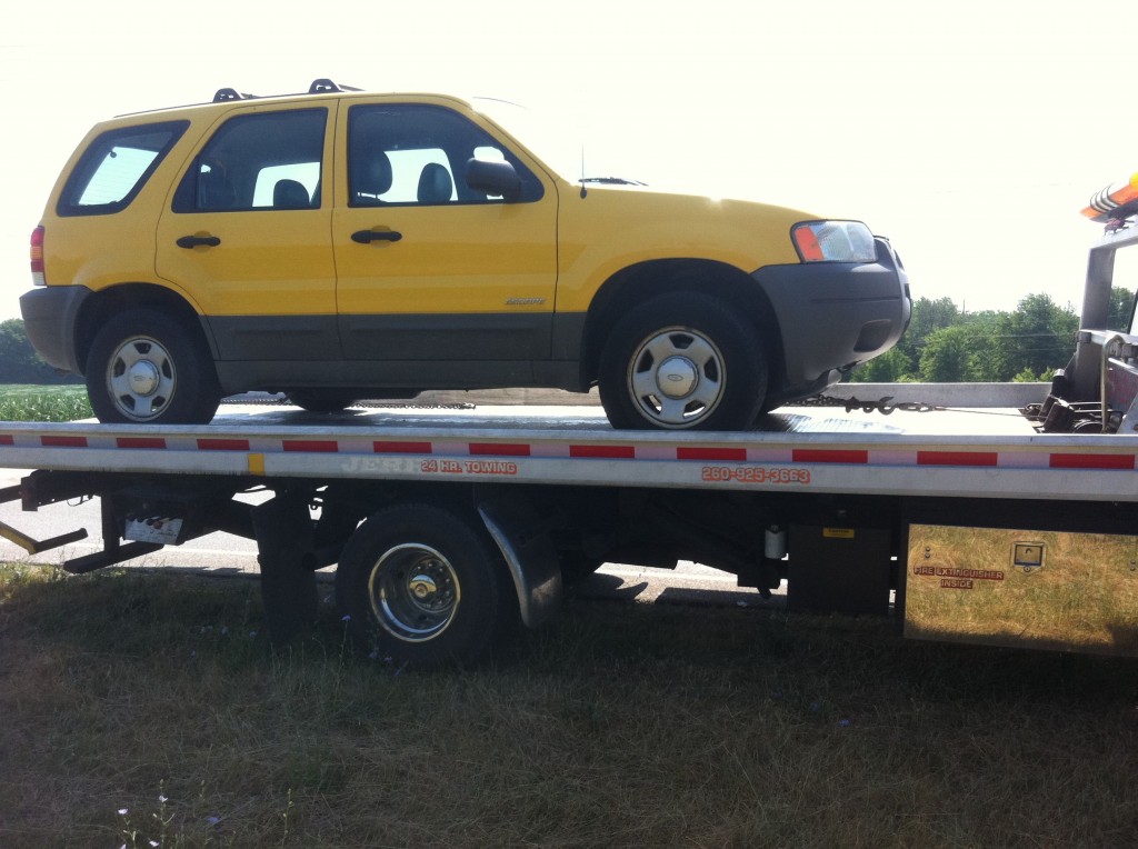 Yellow Ford Escape Being Towed