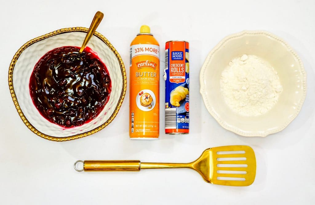 Ingredients for Air Fryer Blueberry Dessert. This Air Fryer Blueberry Dessert is made with crescent rolls, blueberry pie filling, cooking spray and powdered sugar and is made in the Air Fryer.