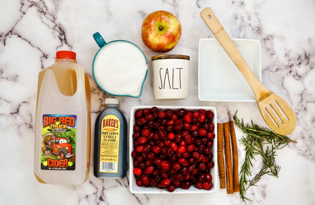 Ingredients to make this Instant Pot Cranberry Sauce are: fresh cranberries, cinnamon sticks, sugar, apple cider , Apple slices, rosemary, vanilla and salt